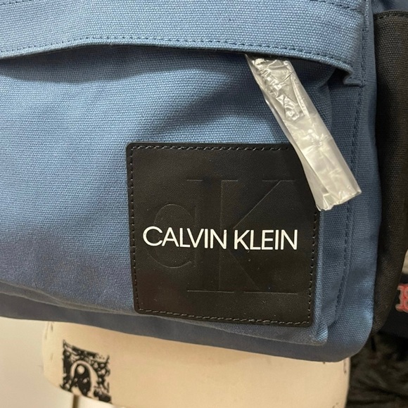 Brand New Unisex Calvin Klein Large Canvas Backpack With Exterior Leather Trim - Picture 2 of 8